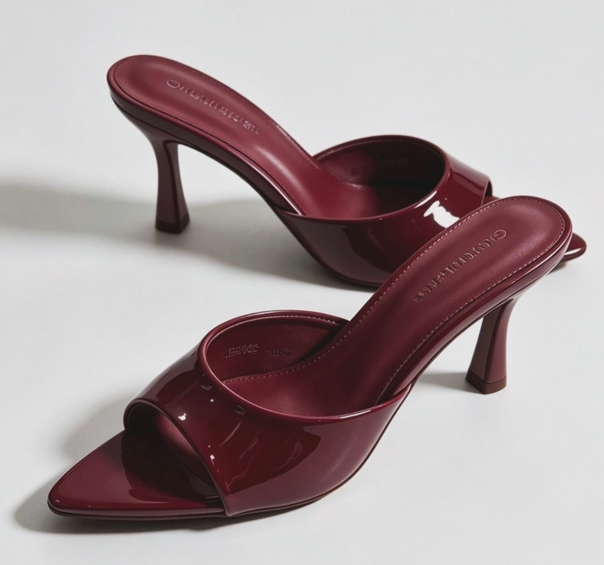 Mules con tacco lucide