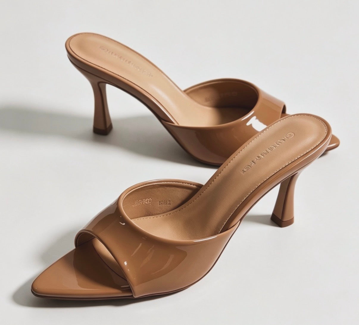 Mules con tacco lucide